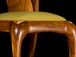 Modern walnut carved chair detail